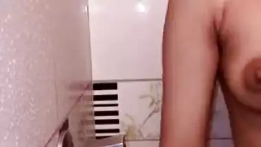 Teen Desi girl takes a shower and exposes her XXX tit and brown nipple