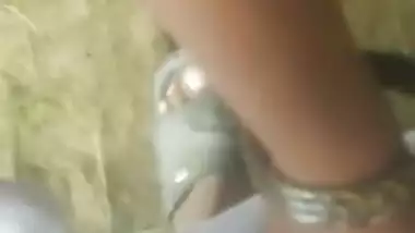 Sexy Desi Dehati beauty shows her shaved XXX pussy in outdoor MMS clip