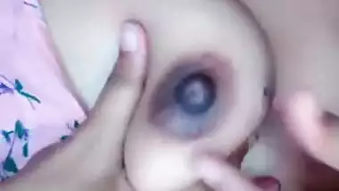 Horny Desi whore reveals and licks her young boobs on XXX camera