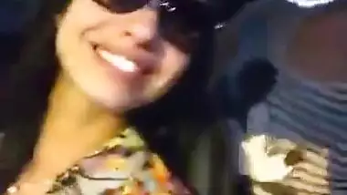 Two hot babes flash there boobs and kiss each other in moving ca