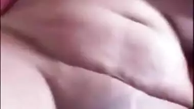 Indian chick in a red robe bares her natural XXX breasts to the sex fan