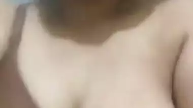 Pleasant Indian girl squeezes left breast and it also can be called porn