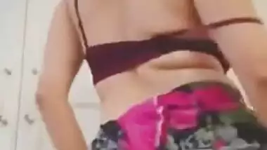 Woman in sari perform XXX dance and slowly strips down moving body