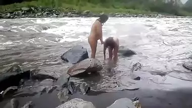 Two fat Desi women show their XXX assets while relaxing naked in river