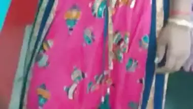 Hot like hell Desi female in sexy pink dress poses for the camera