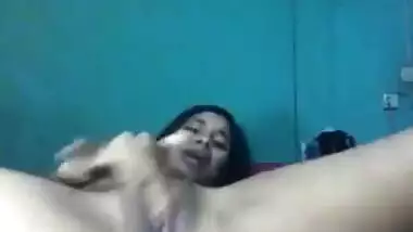 Desi female lies on back and wildly masturbates her XXX cherry on camera