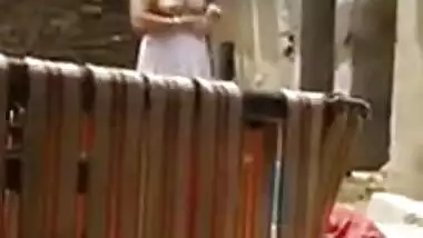 Neighbor can't resist filming porn video when he sees Desi girl undressing