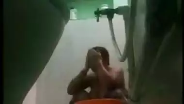 Desi MILF bares XXX charms taking a shower in front of a era