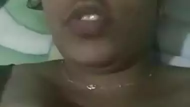 Indian aunty with sexy full lips takes big natural boobs out in bed