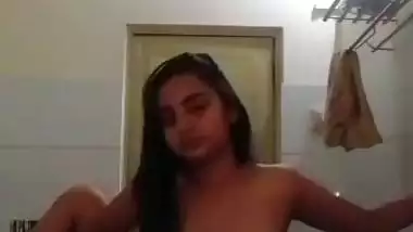 Indian nude MMS of an 18-year-old girl fingering in a bathroom