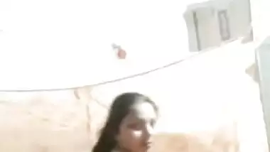 Sexy housewife strips and shakes her big Desi booty for the camera